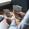 businessman-is-counting-dollars-banknotes-business-and-financial-background.jpg businessman-is-counting-dollars-banknotes-business-and-financial-background.jpg